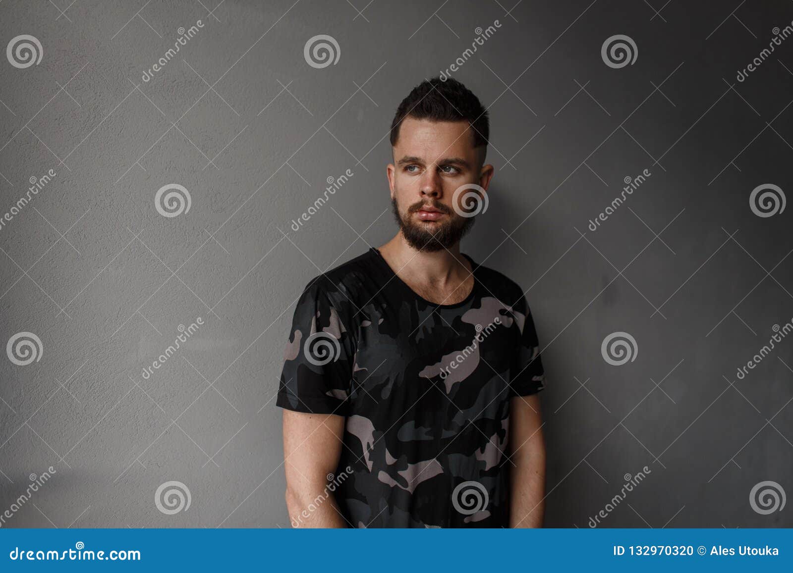 Attractive Young Man With A Stylish Hairstyle And Brutal Beard