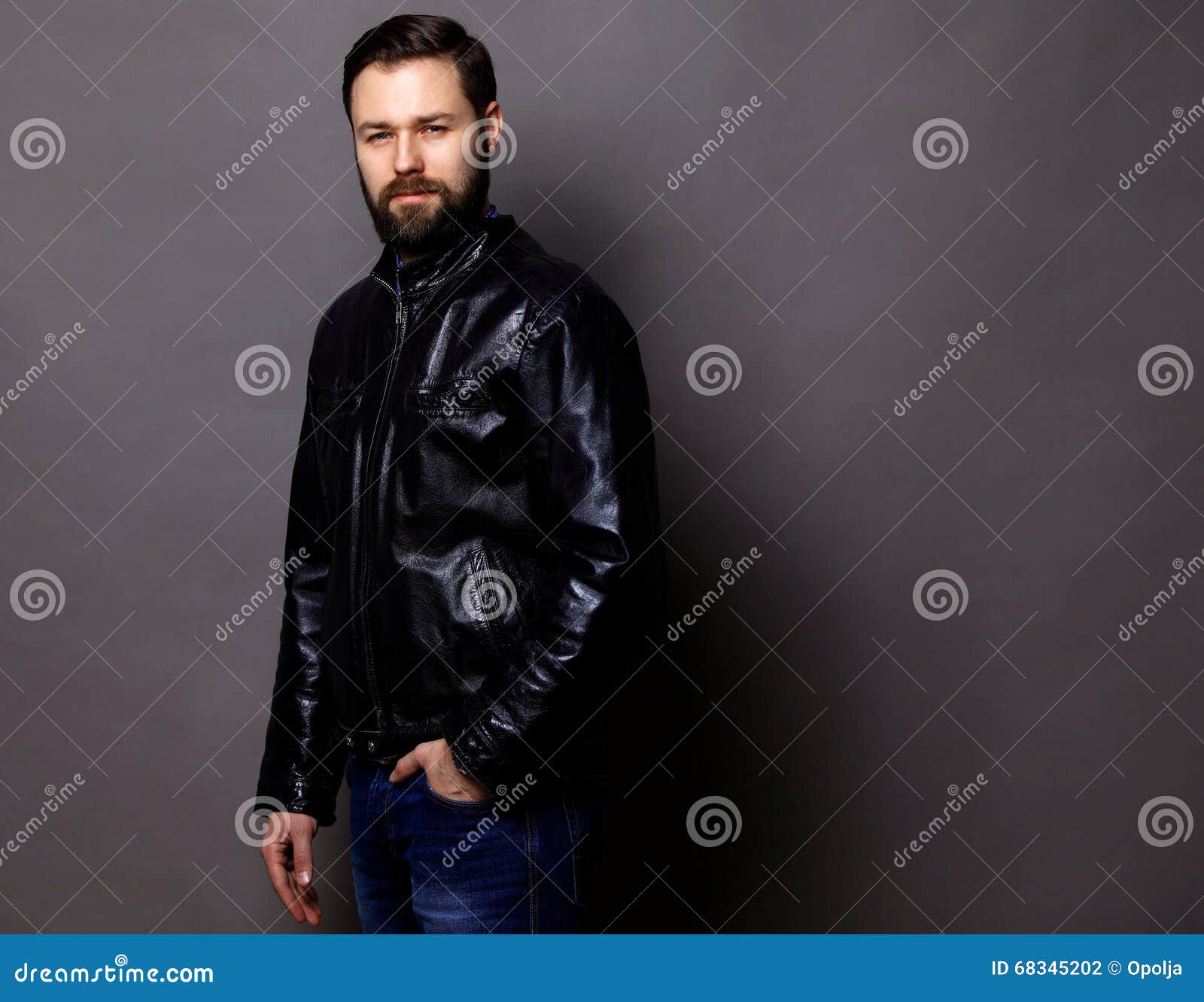 Attractive Young Man Wearing Leather Jacket on Gray Stock Photo - Image ...