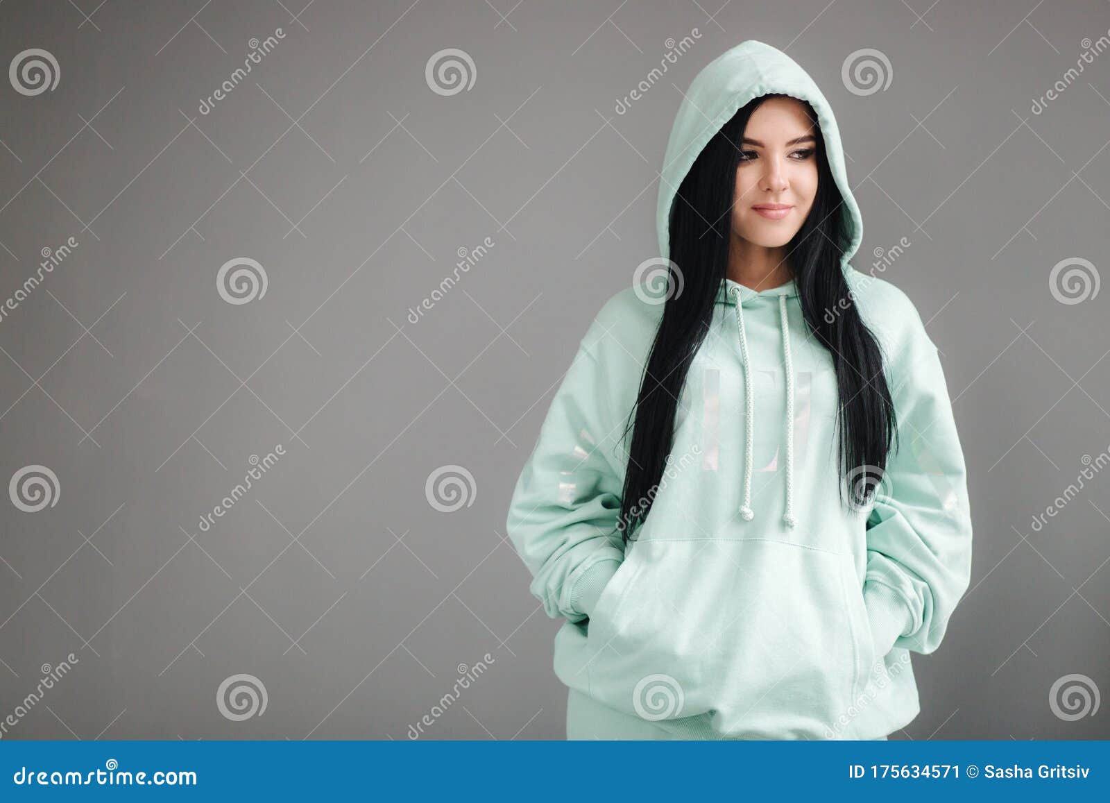 Attractive Young Model in Tracksuit. Woman Demonstrating Clothes in ...