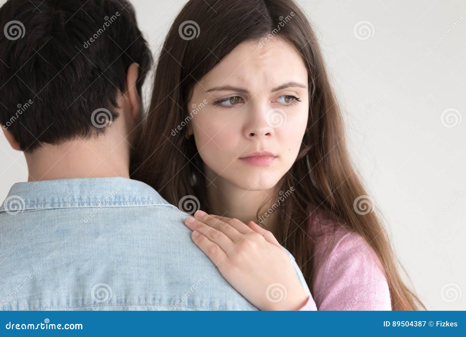 Attractive Young Woman Embracing Man, Girl Looking Serious and W Stock ...