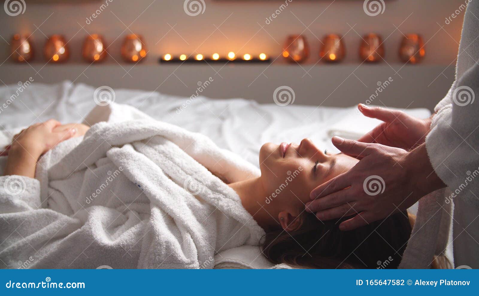 Attractive Young Woman Receiving Head Massage At Spa Center Stock