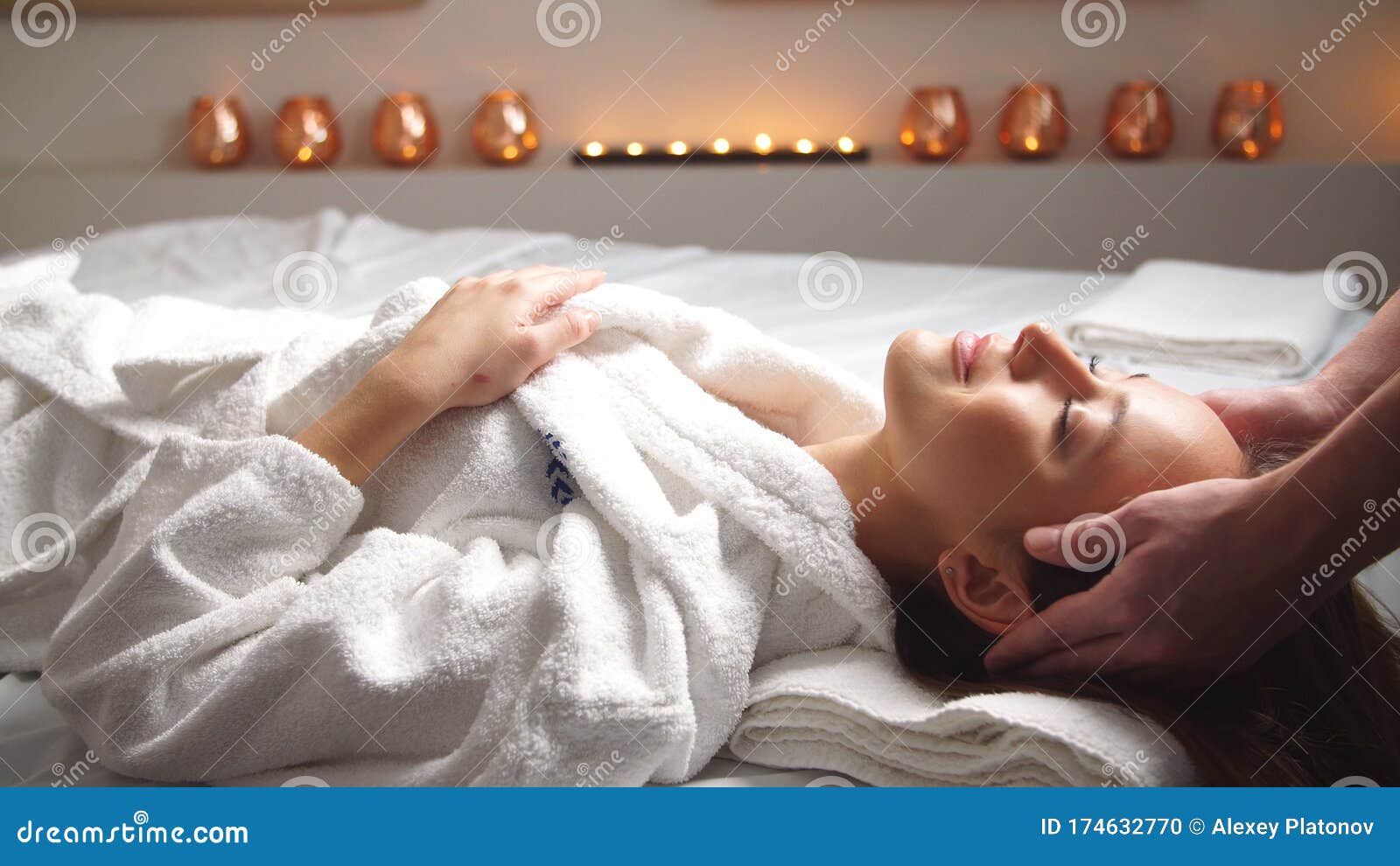 Attractive Young Woman Receiving Head Massage At Spa Center Stock