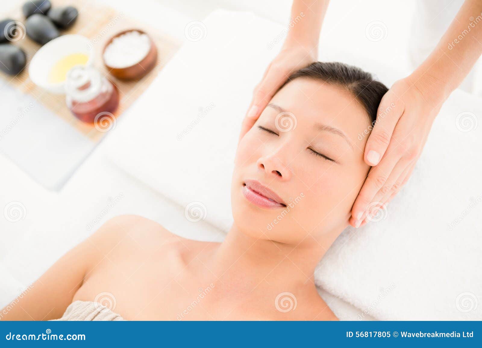 Attractive Young Woman Receiving Head Massage At Spa Center Stock Image
