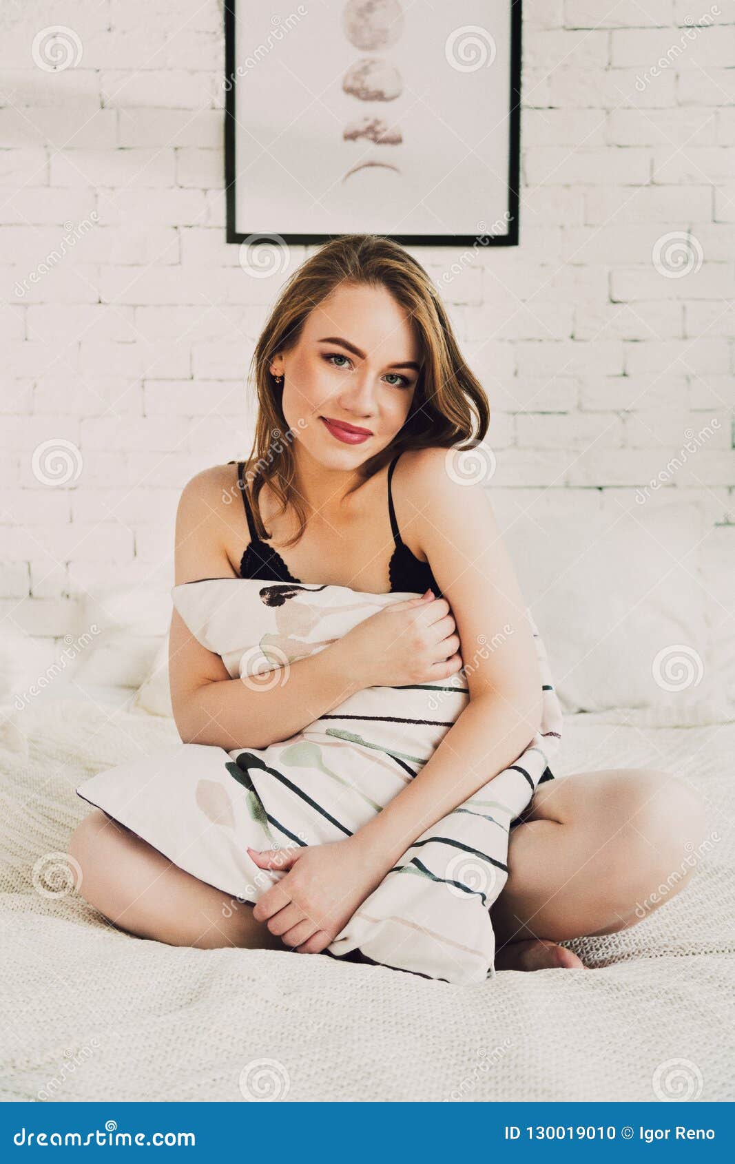 Young Woman Wearing Revealing Underwear Lounging In Bedroom Stock Photo,  Picture and Royalty Free Image. Image 62610429.