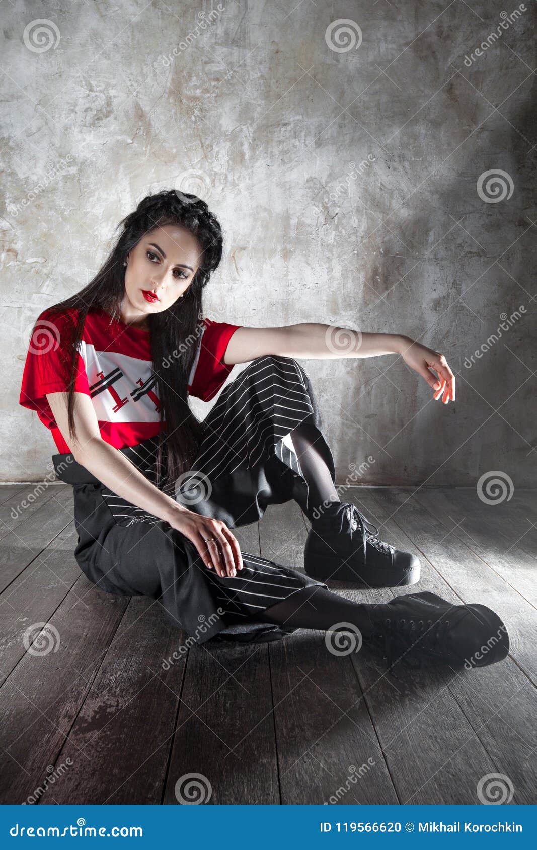 Attractive Young Woman Showing Designer Clothes in Studio Stock Photo ...