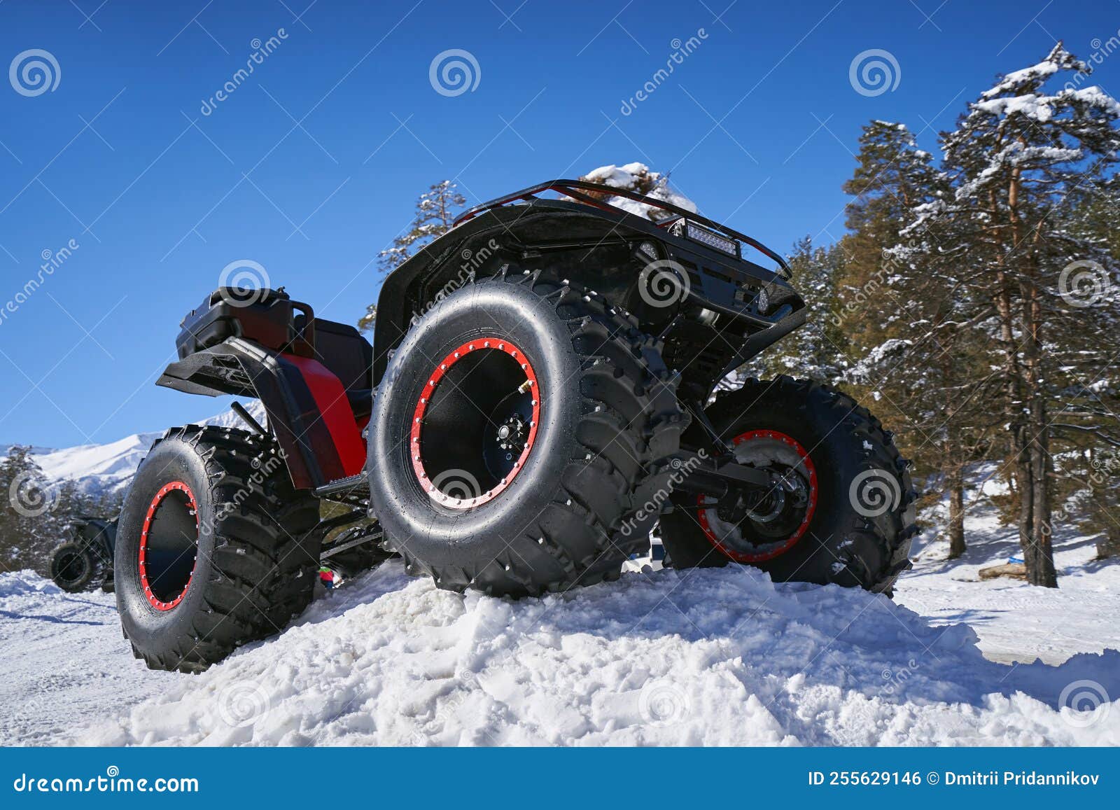 ATV with Big Wheels on the Snow Stock Photo Image of large, adventure 255629146