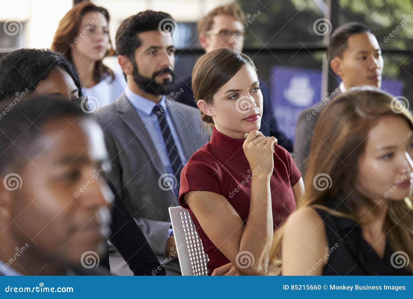 audience at a business seminar listening to a speaker