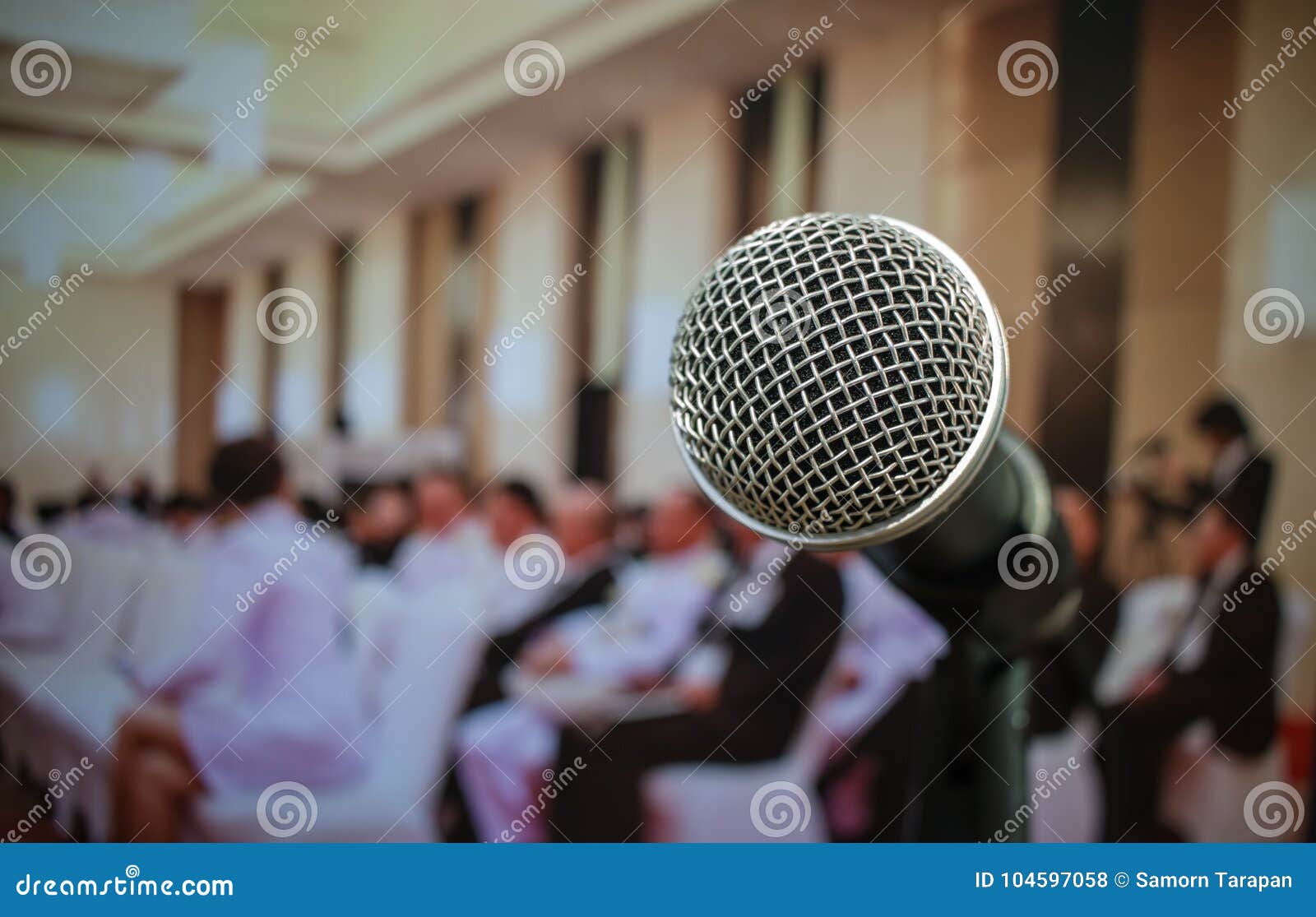 audience listening speaker speech in conference hall or seminar