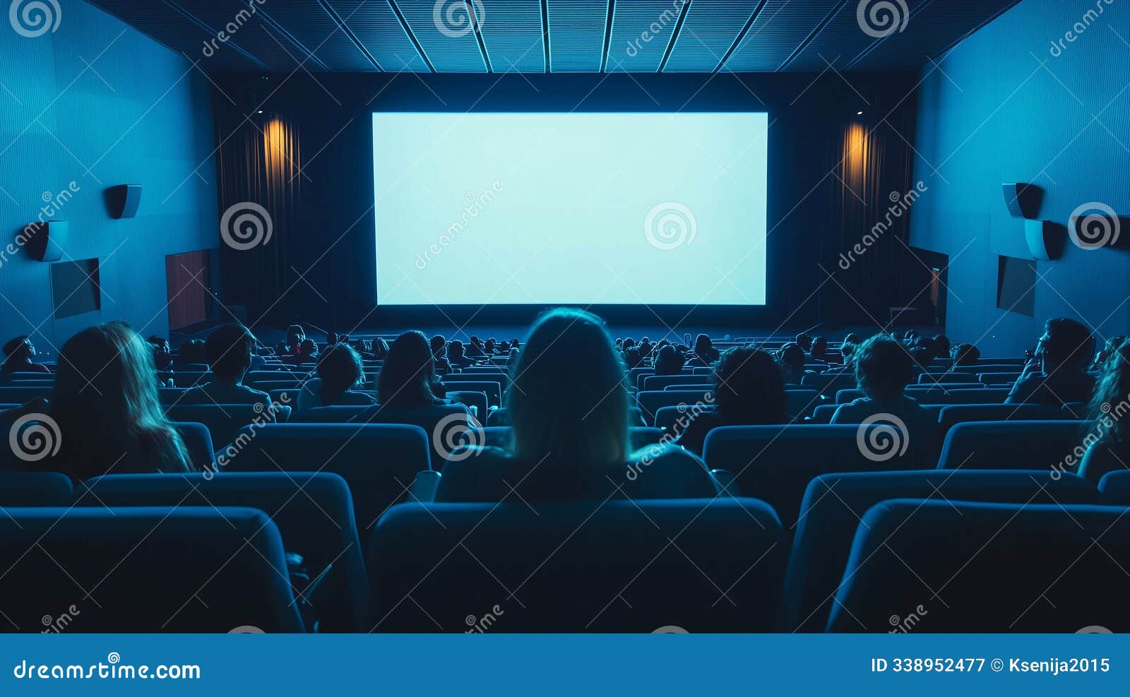 audience seated in a movie theater watching a film on a large screen, with red lighting creating an immersive and cinematic