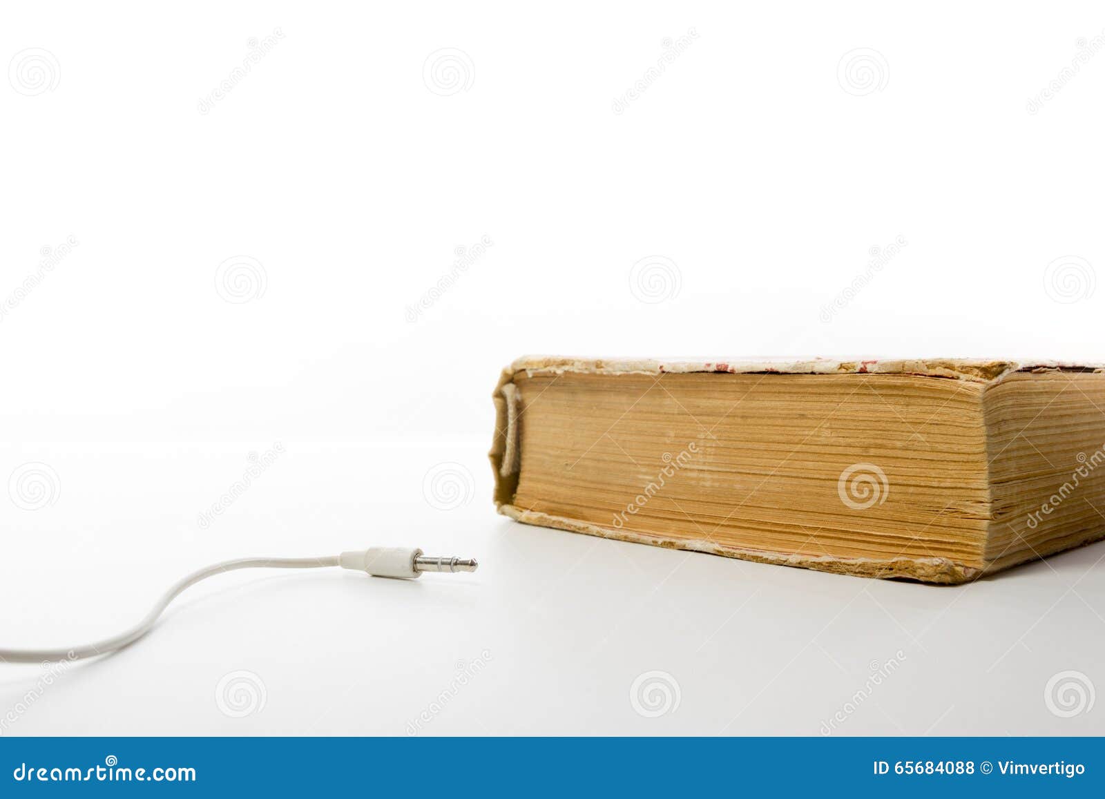 Audio Book Stack of Hardback Books and Electronic Reader. Electronic