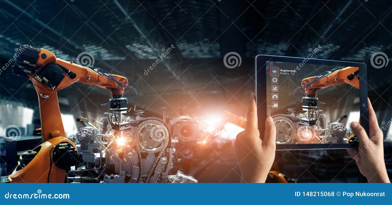 augmented reality industry concept. hand holding digital tablet use ar application to check and control welding robotics automatic