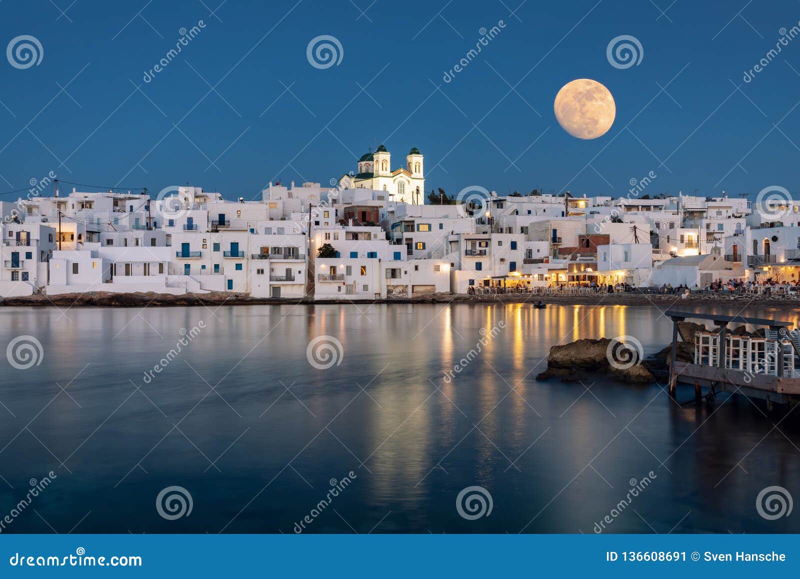 august full moon over the idyllic village of naousa, paros