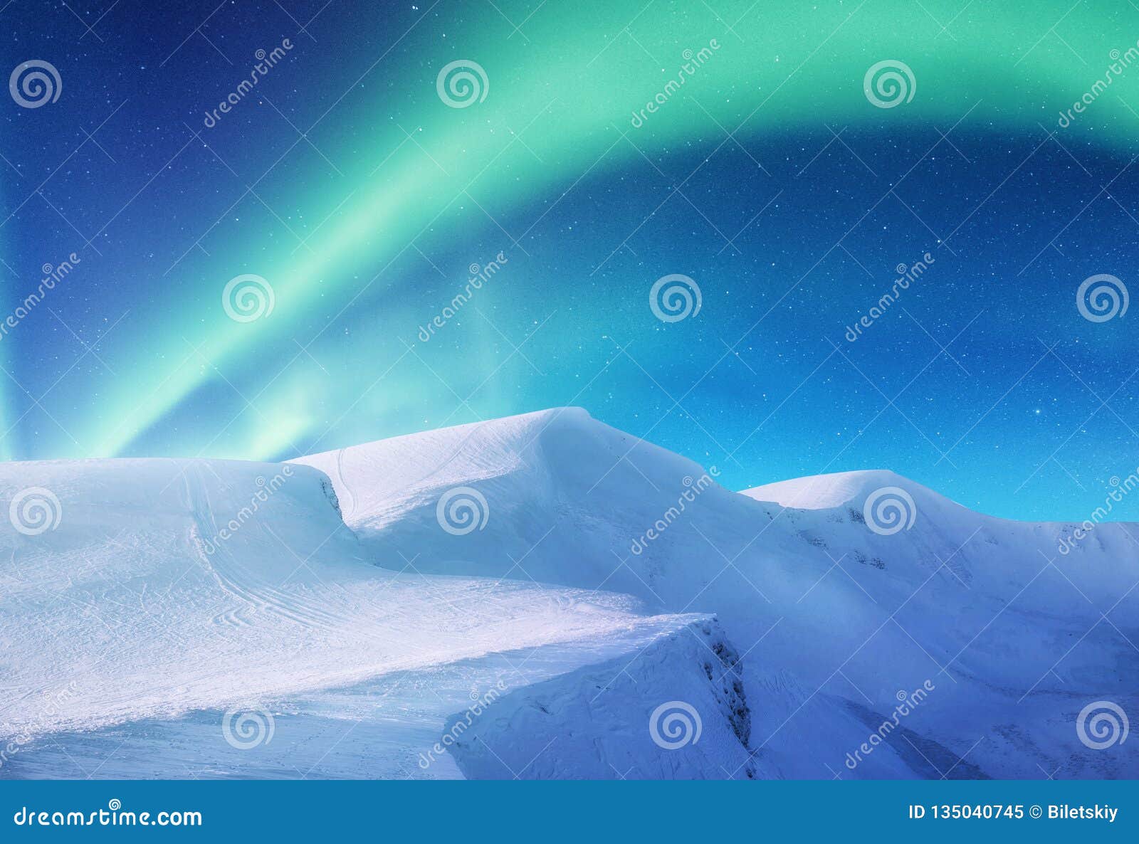 aurora borealis on the lofoten islands, norway. green northern lights above mountains. night sky with polar lights.