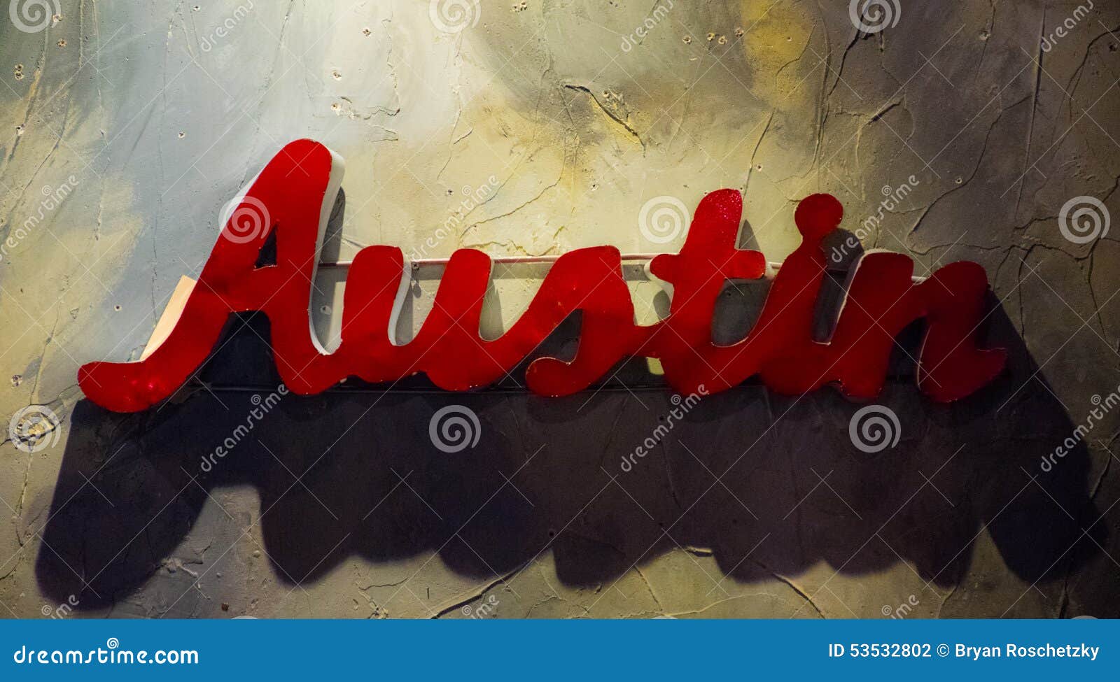 austin texas metal sign hanging on textured wall