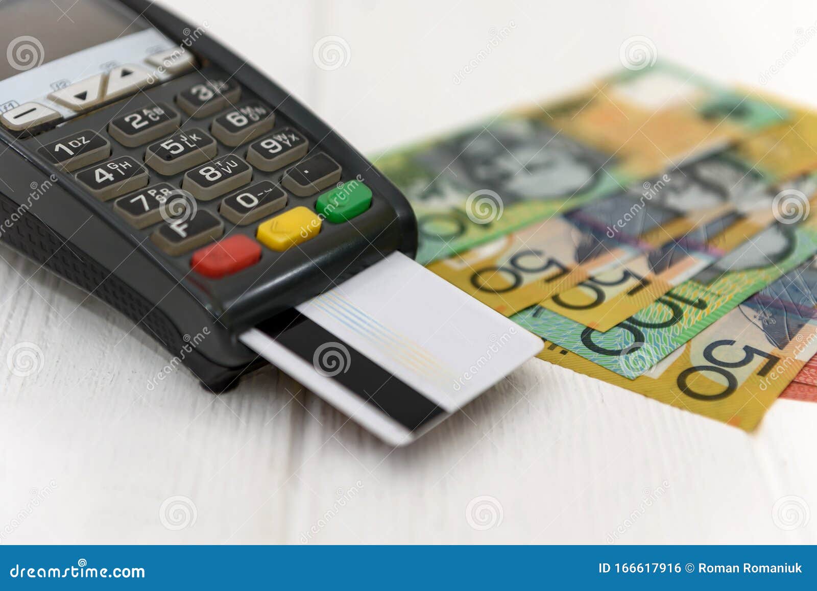 australian-dollar-banknotes-with-terminal-and-credit-card-stock-photo
