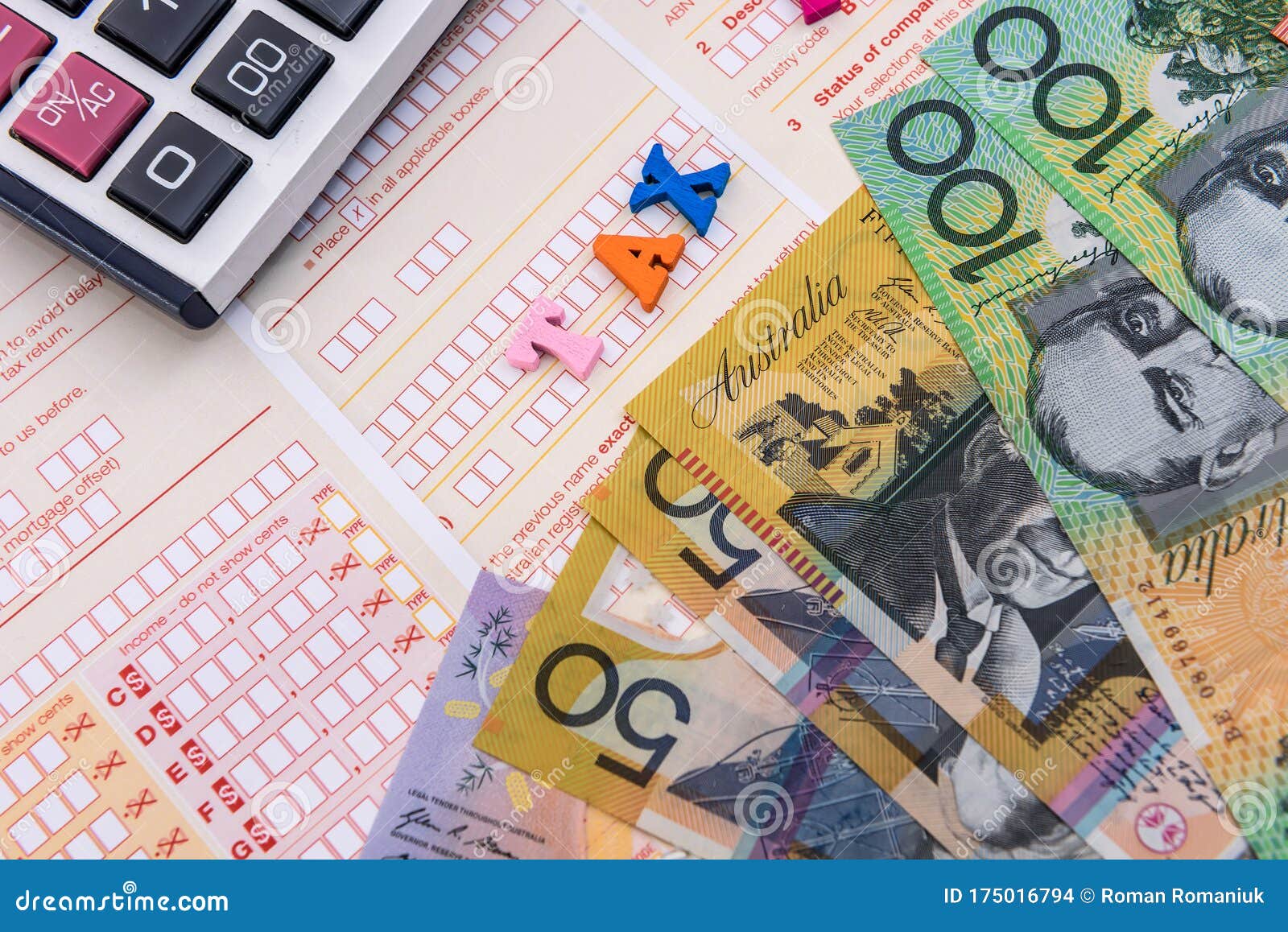 Australian Dollars with Calculator on Tax Declaration Stock Photo