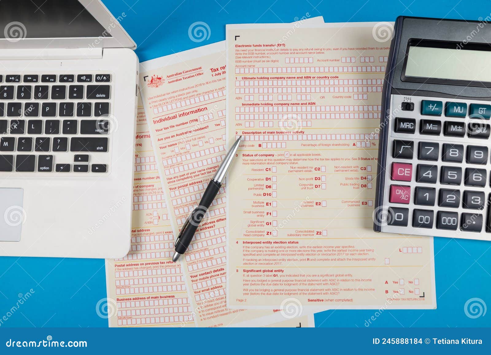 Australian Tax Forms with Laptop and Calculator Editorial Stock Image