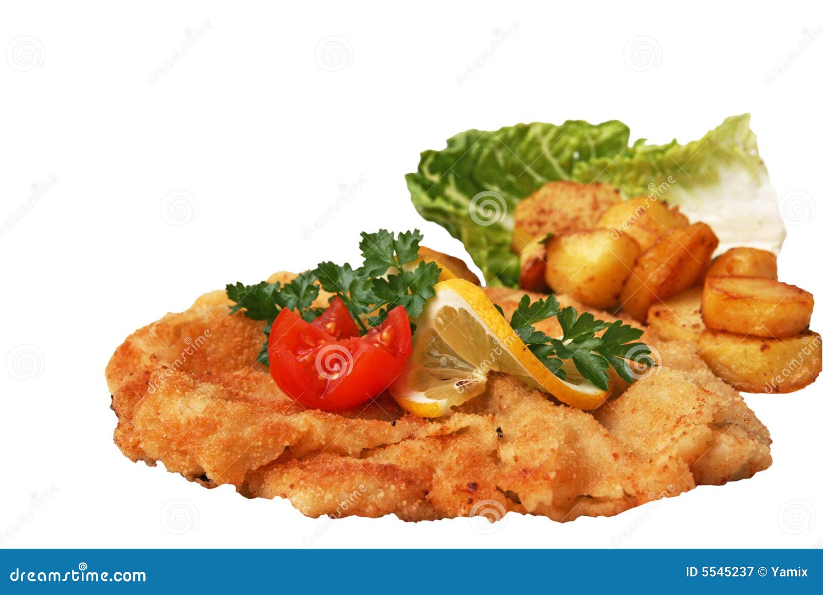 Austrian culture. Breaded veal escalope (Wiener Schnitzel) garnished with lemon, potatoes and parsley leaf