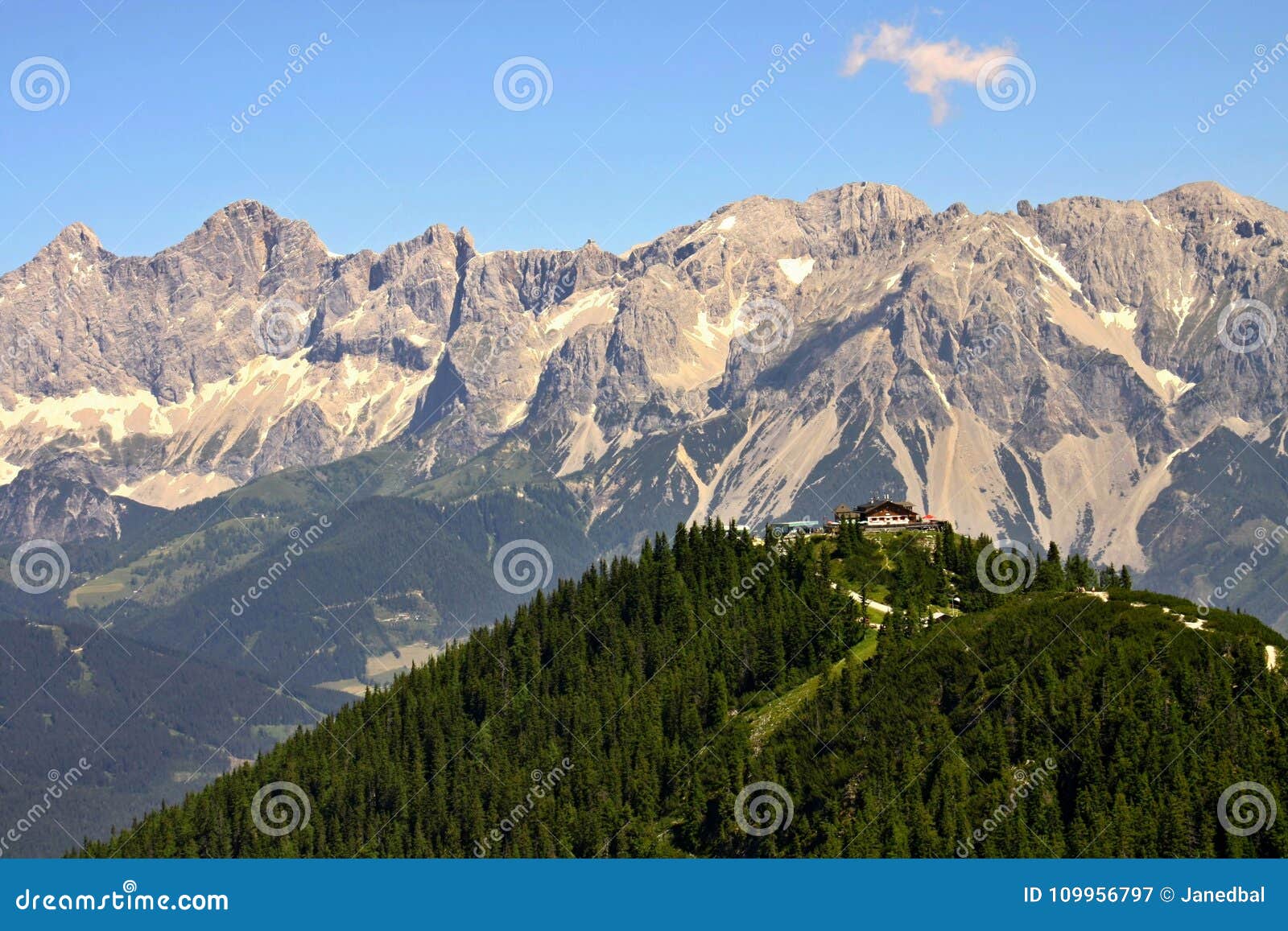 austrian hut with dachstein moutain range in behind