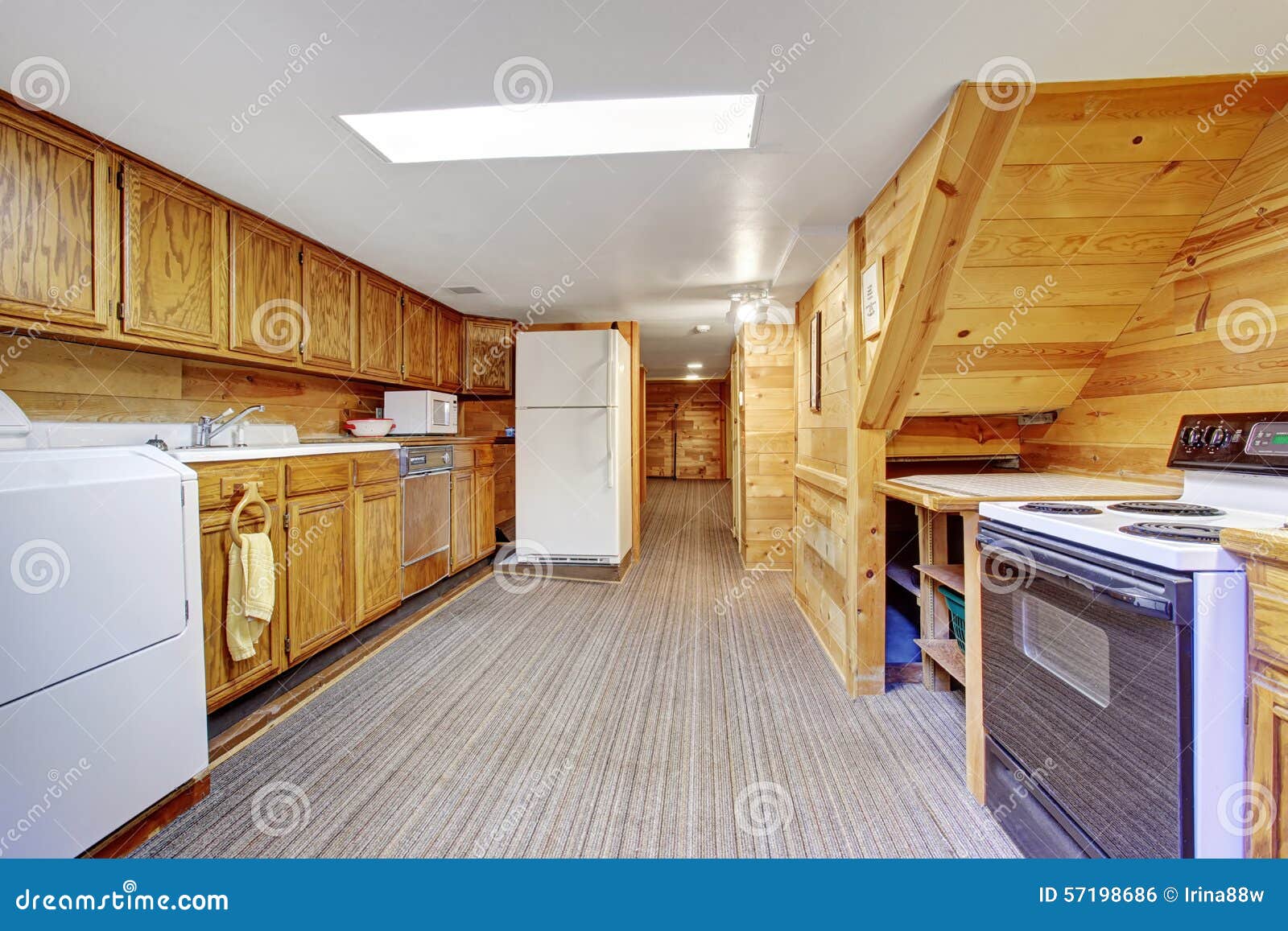 Authentic Kitchen Laundry Room Combo with Carpet. Stock Photo Image