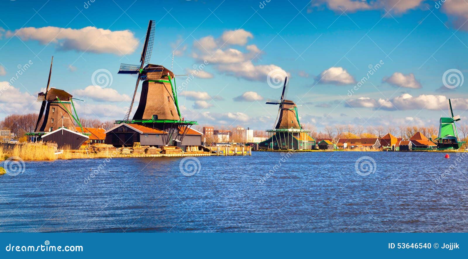 authentic zaandam mills on the water channel in zaanstad willage