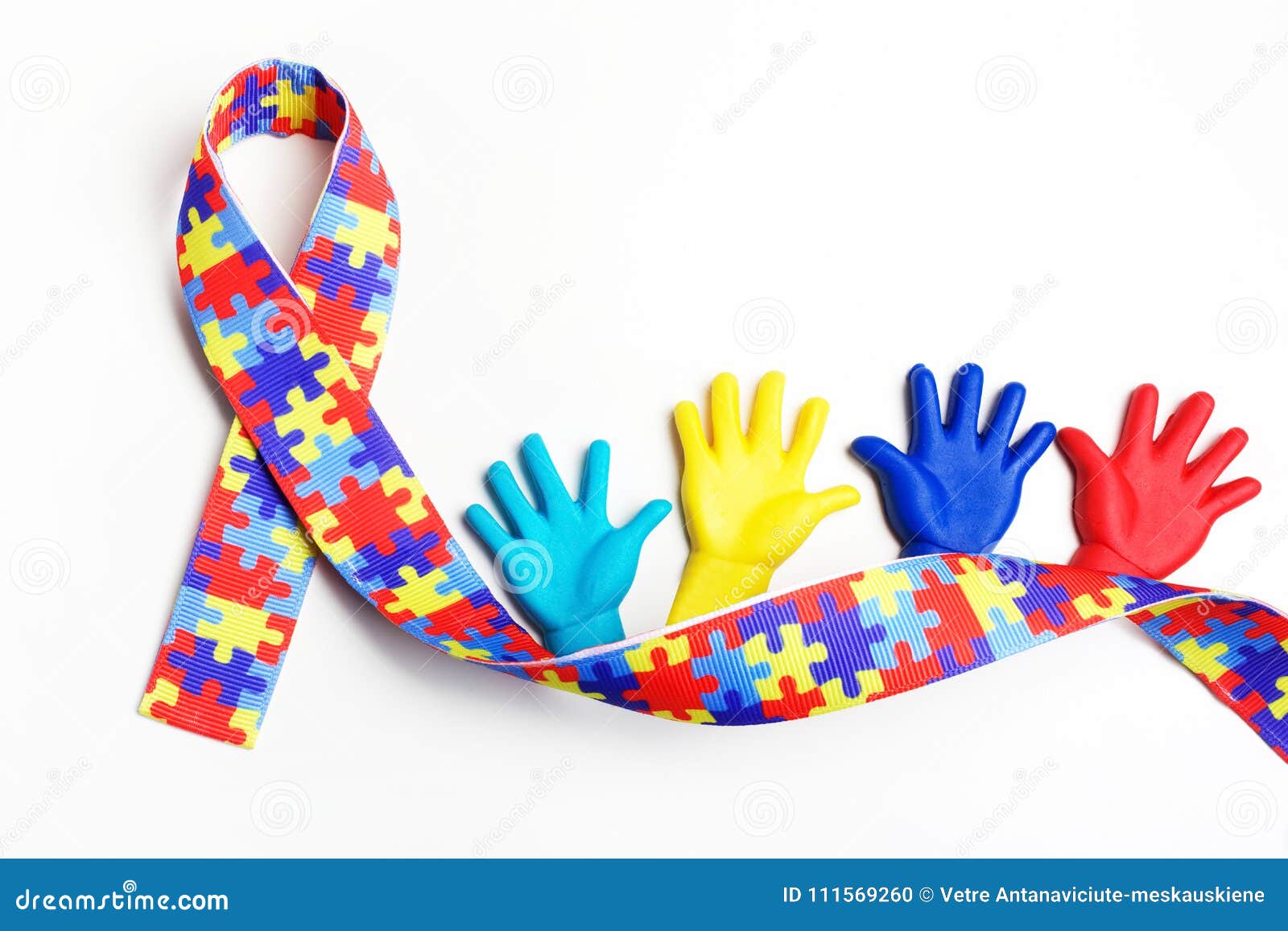 autism awareness concept with colorful hands on white background. top view
