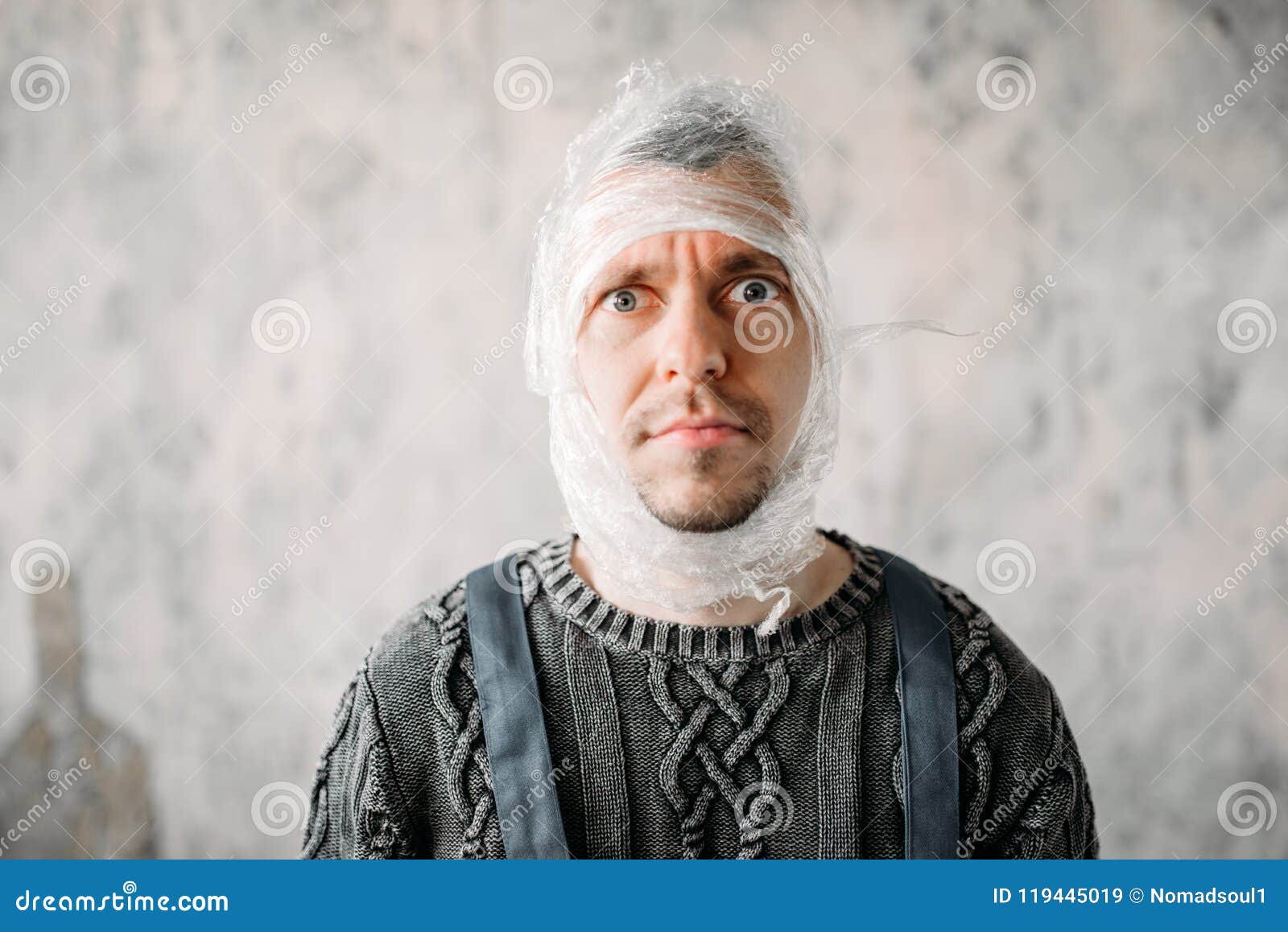 autist with stretch film on head, autism