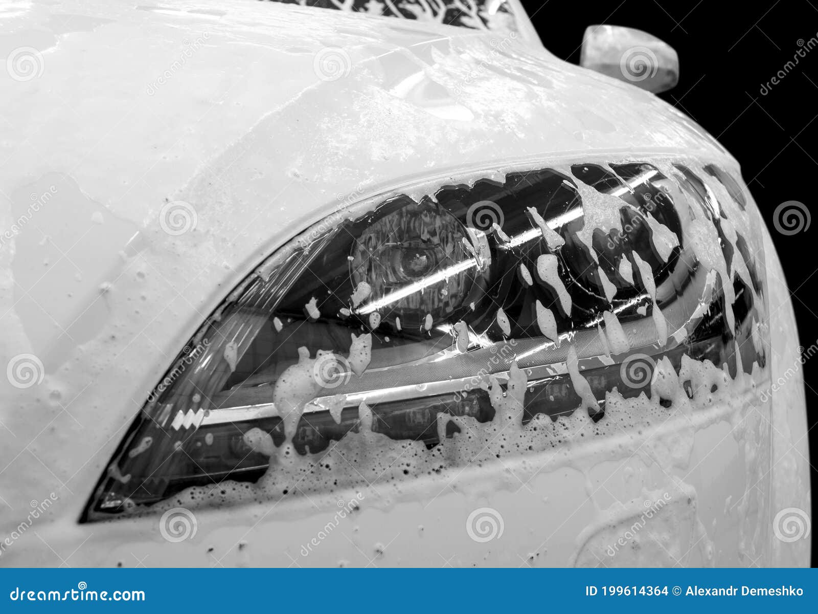 Auto Headlamp Covered by Foam. Modern Car Wash with Soap. Stock Photo