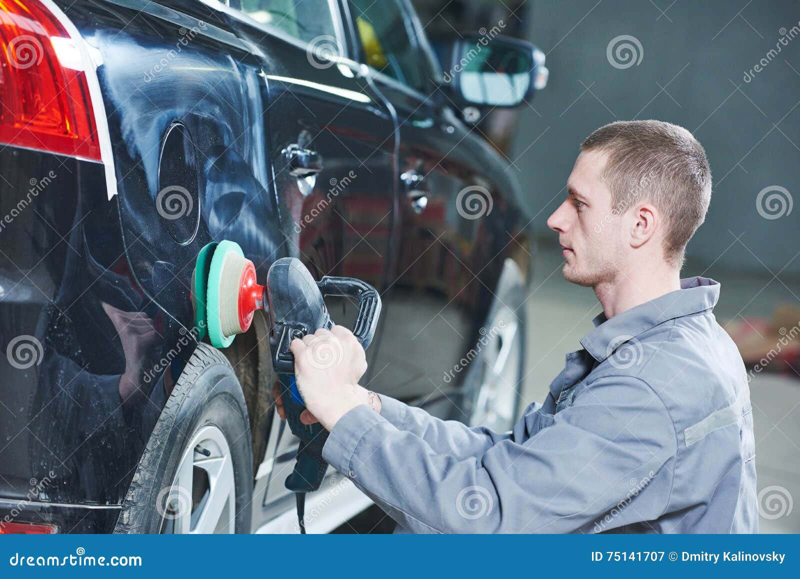 auto mechanic buffing car autobody