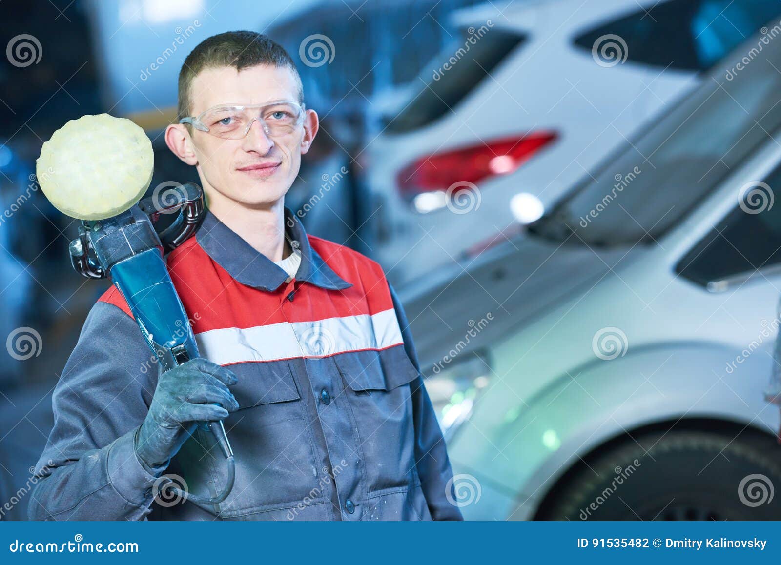 auto mechanic with buffing machine