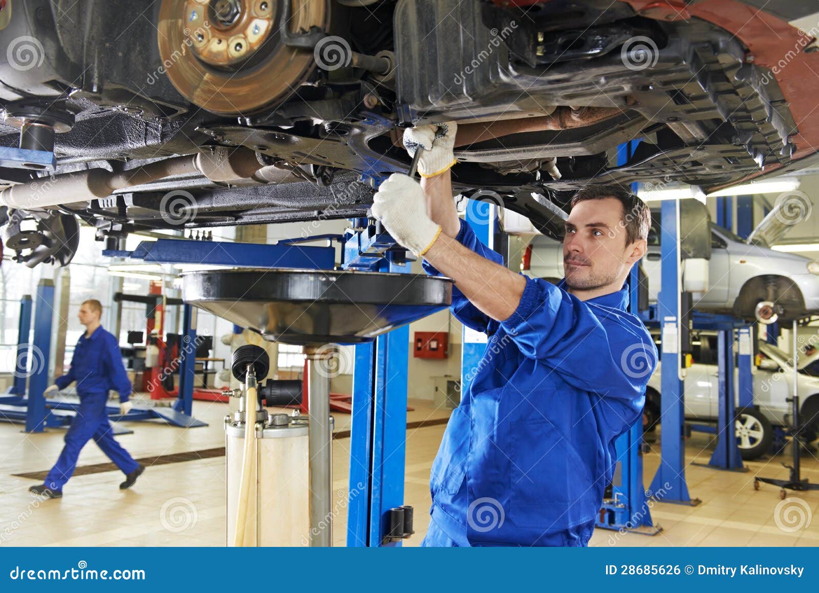 auto mechanic at car suspension repair work