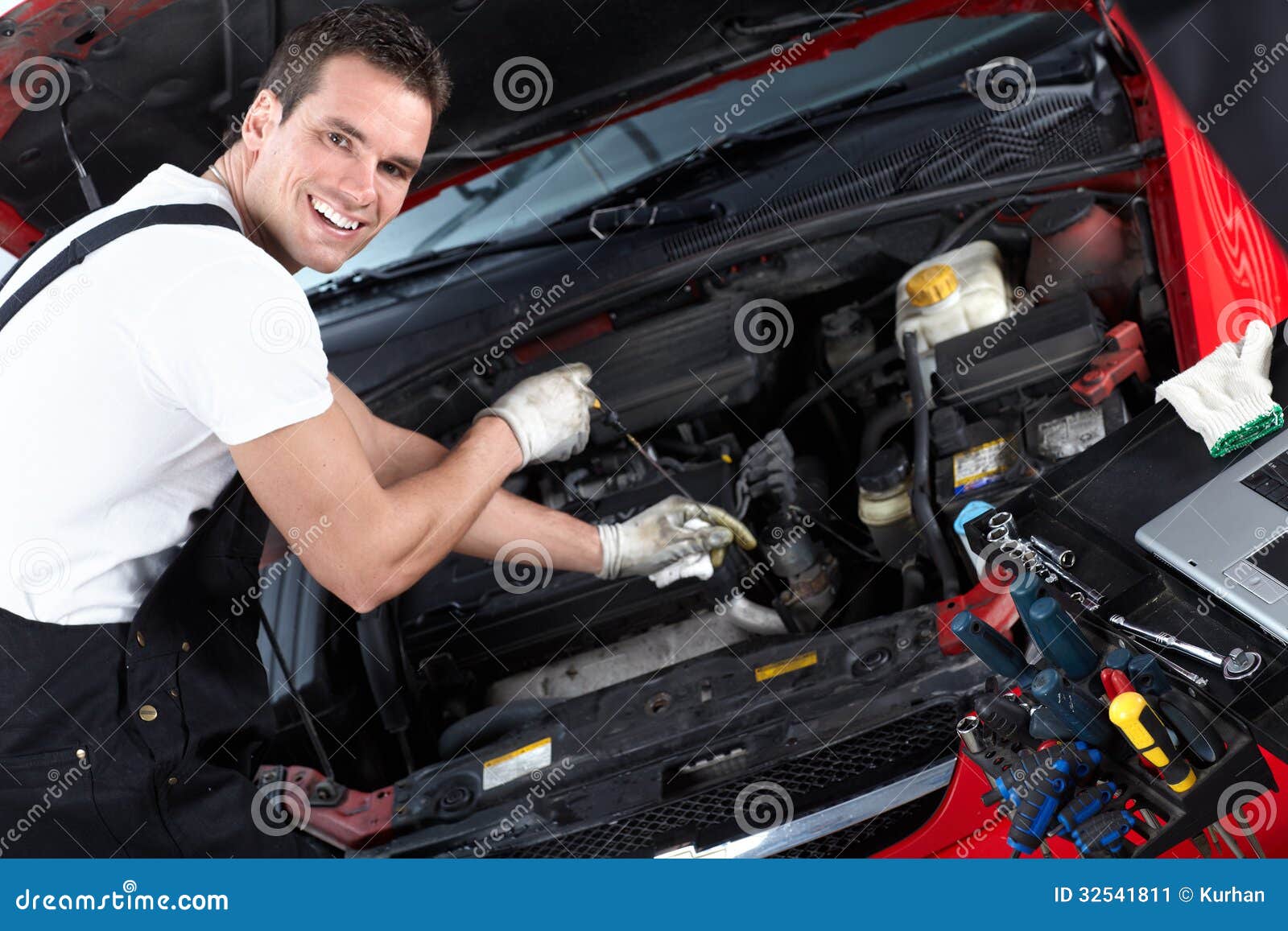mechanic z Oil Car A In Workshop. Checking Mechanic In Man Level mechanic z Oil Car A In Workshop. Checking Mechanic In Man Level