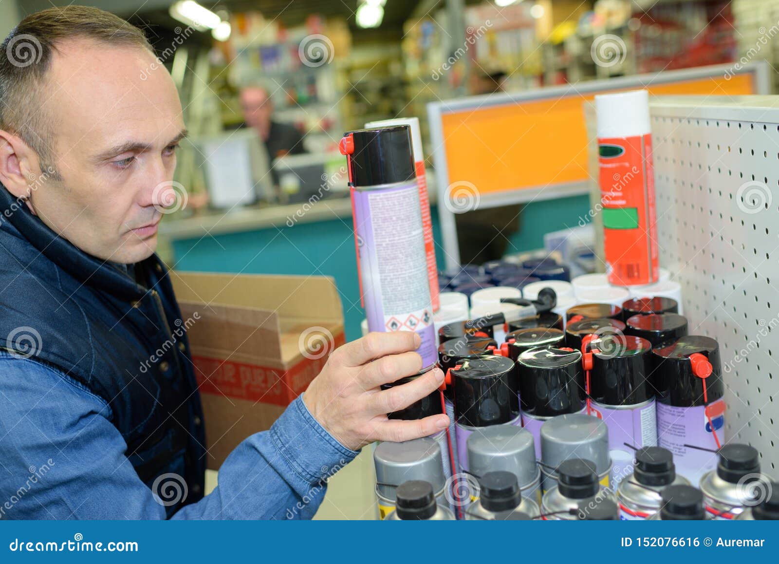 Auto Mechanic Choosing Oil at Car Store Stock Photo Image of mobile, warehouse 152076616