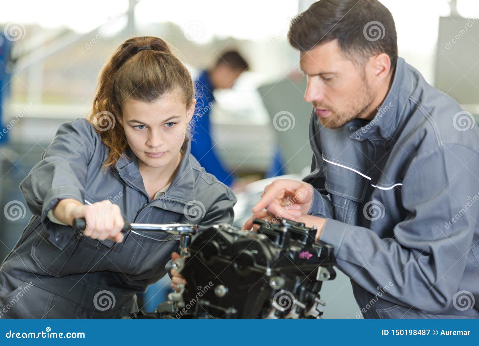 Auto Mechanic Guiding Female Trainee in Garage Stock Image Image of