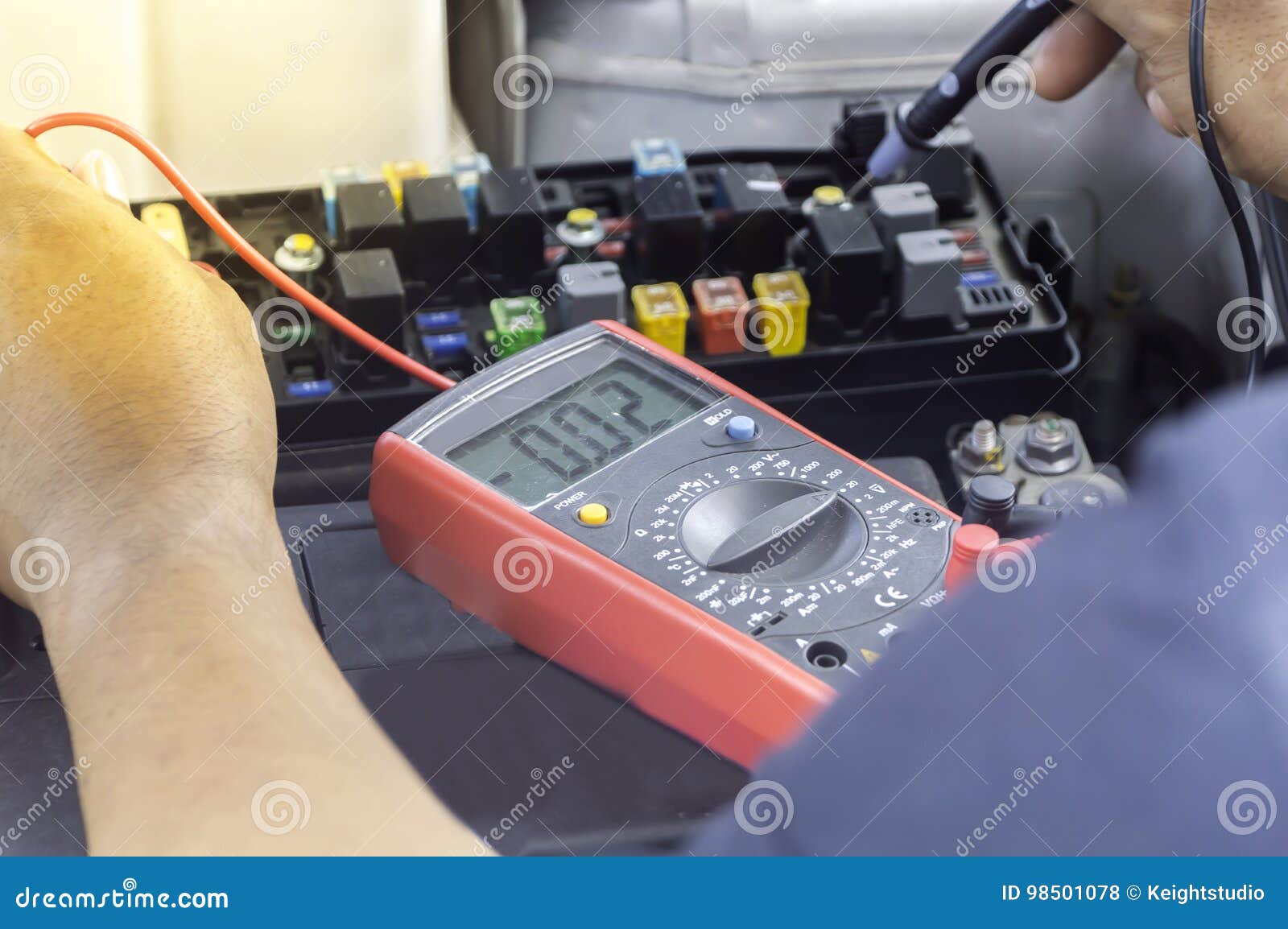 Auto Mechanic Uses a Multimeter Voltmeter. Stock Photo Image of adult