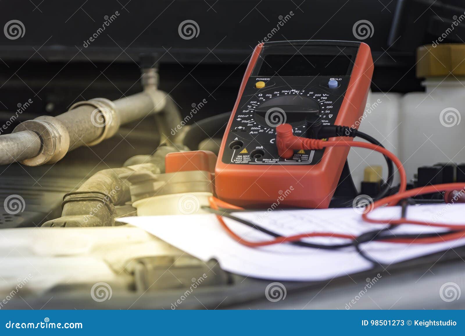 Auto Mechanic Uses a Multimeter Voltmeter. Stock Image Image of