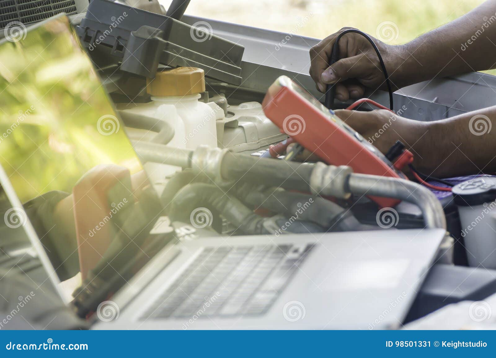 Auto Mechanic Uses a Multimeter Voltmeter. Stock Image Image of hand