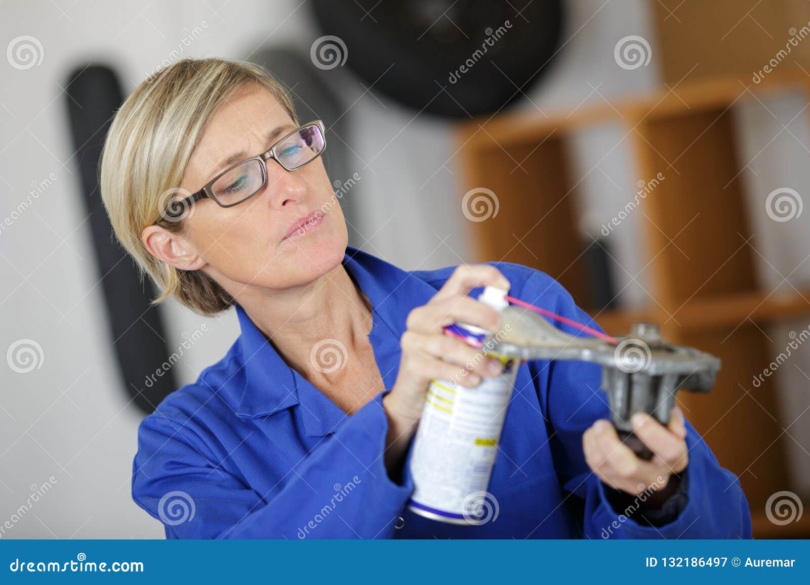 Auto Mechanic Woman Lubricating Auto Part Stock Image Image of