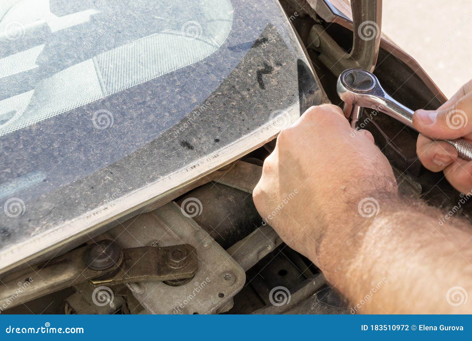 The Car Mechanic Works in the Garage. Repair Stock Photo - Image of ...