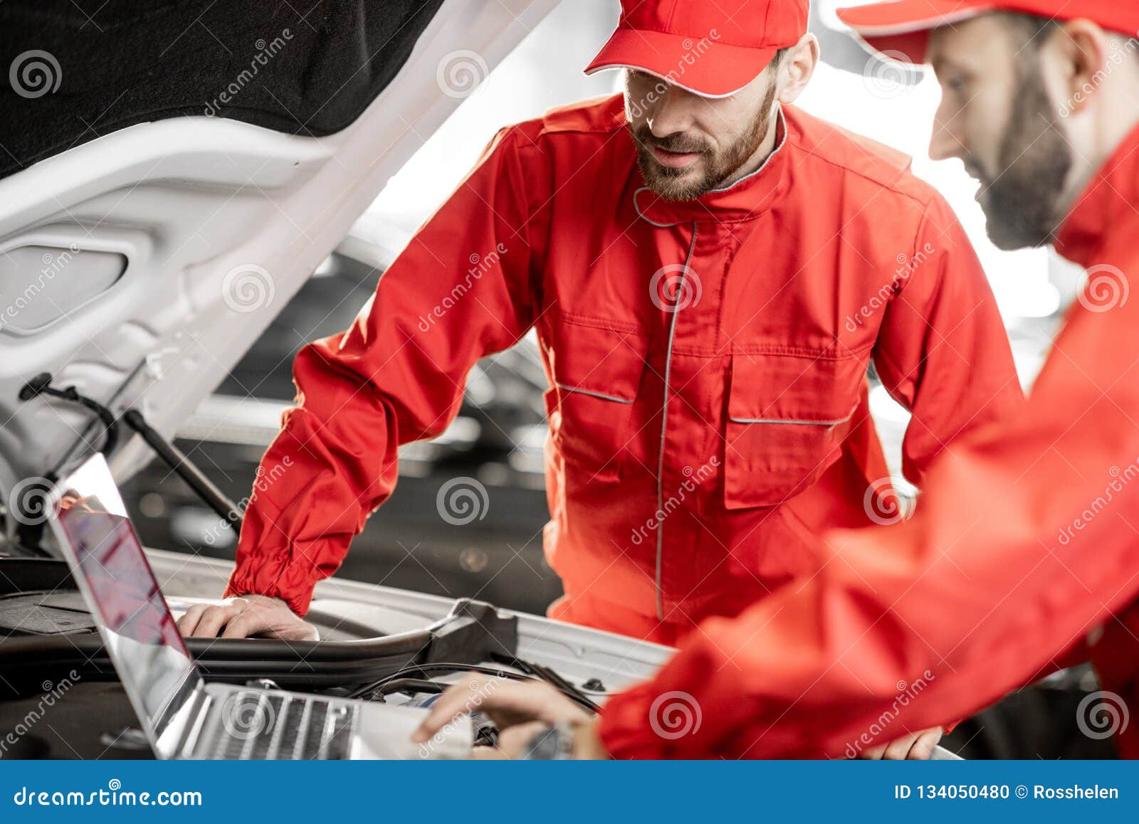 Auto Mechanics Doing Diagnostics with Laptop Stock Photo Image of