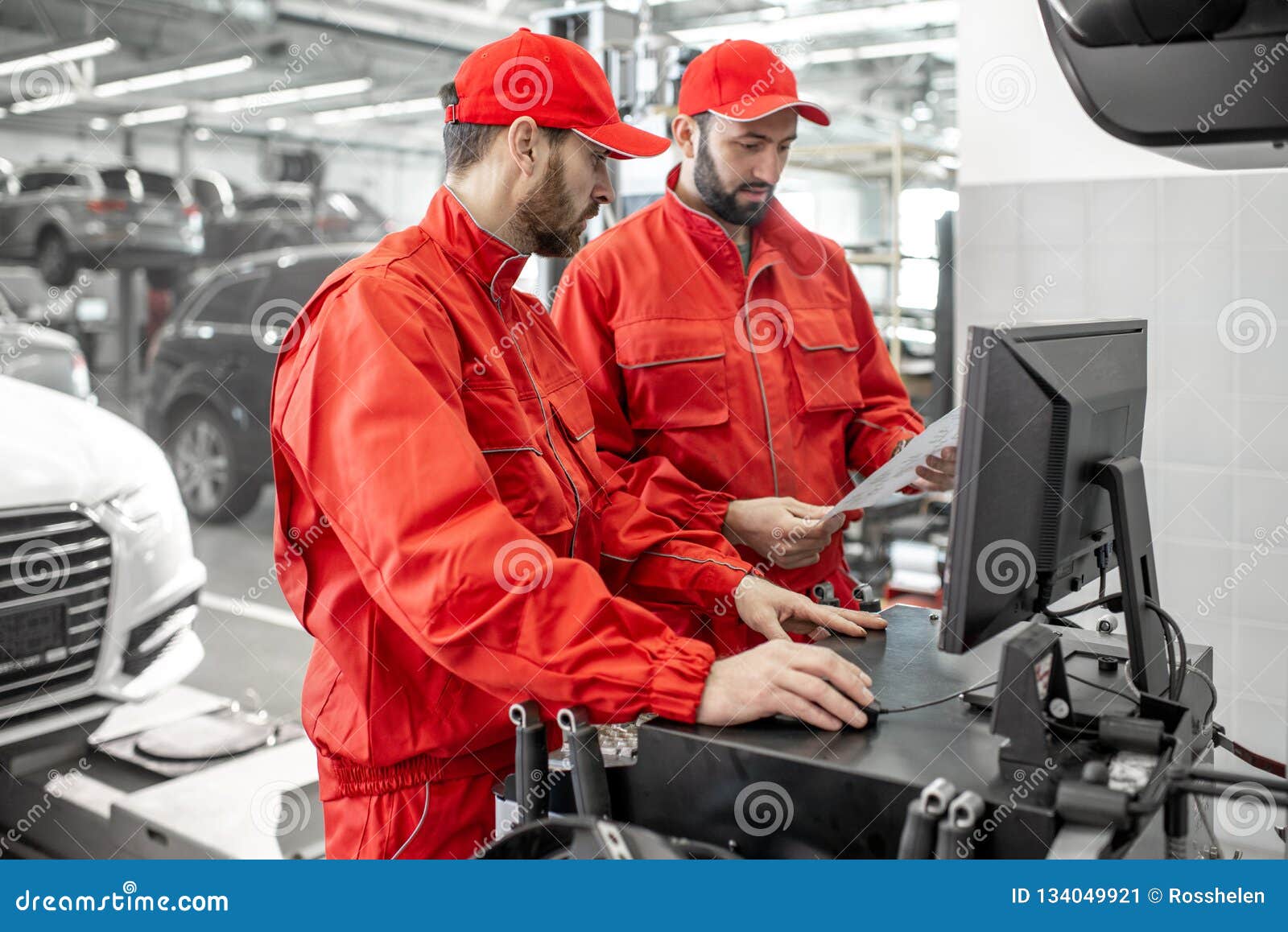 Auto Mechanics Serving Luxury Car at the Car Service Stock Image
