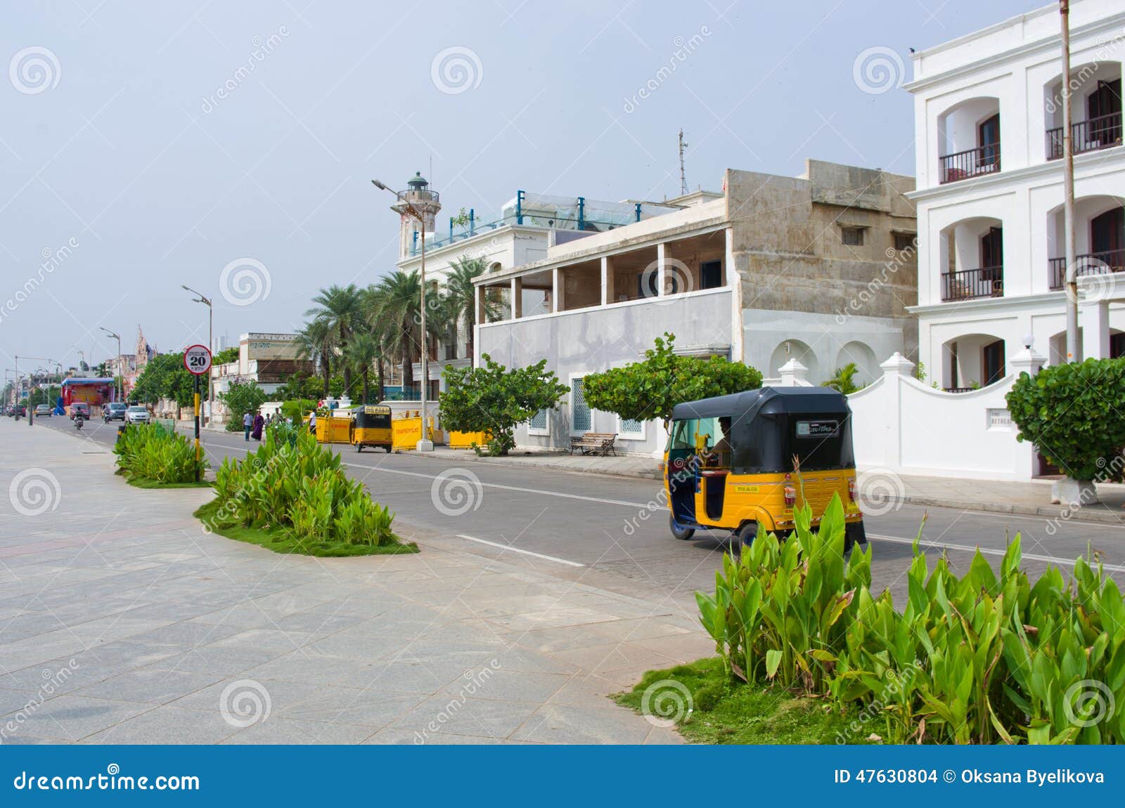 Auto rickshaw on the street in Pondicherry, India. PONDICHERRY (PUDUCHERRY), INDIA - OCT 12, 2014: Auto rickshaw or tuk-tuk on the street in Pondicherry also known as Puducherry, India, on 12 Oct 2014