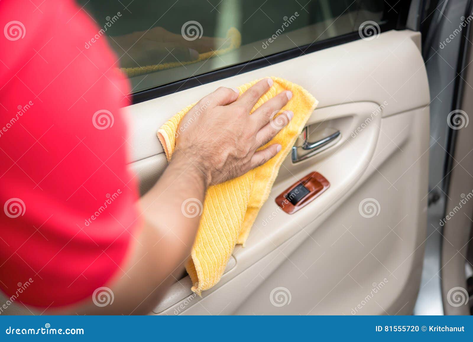 Auto Service Staff Cleaning Car Door Interior Panel With