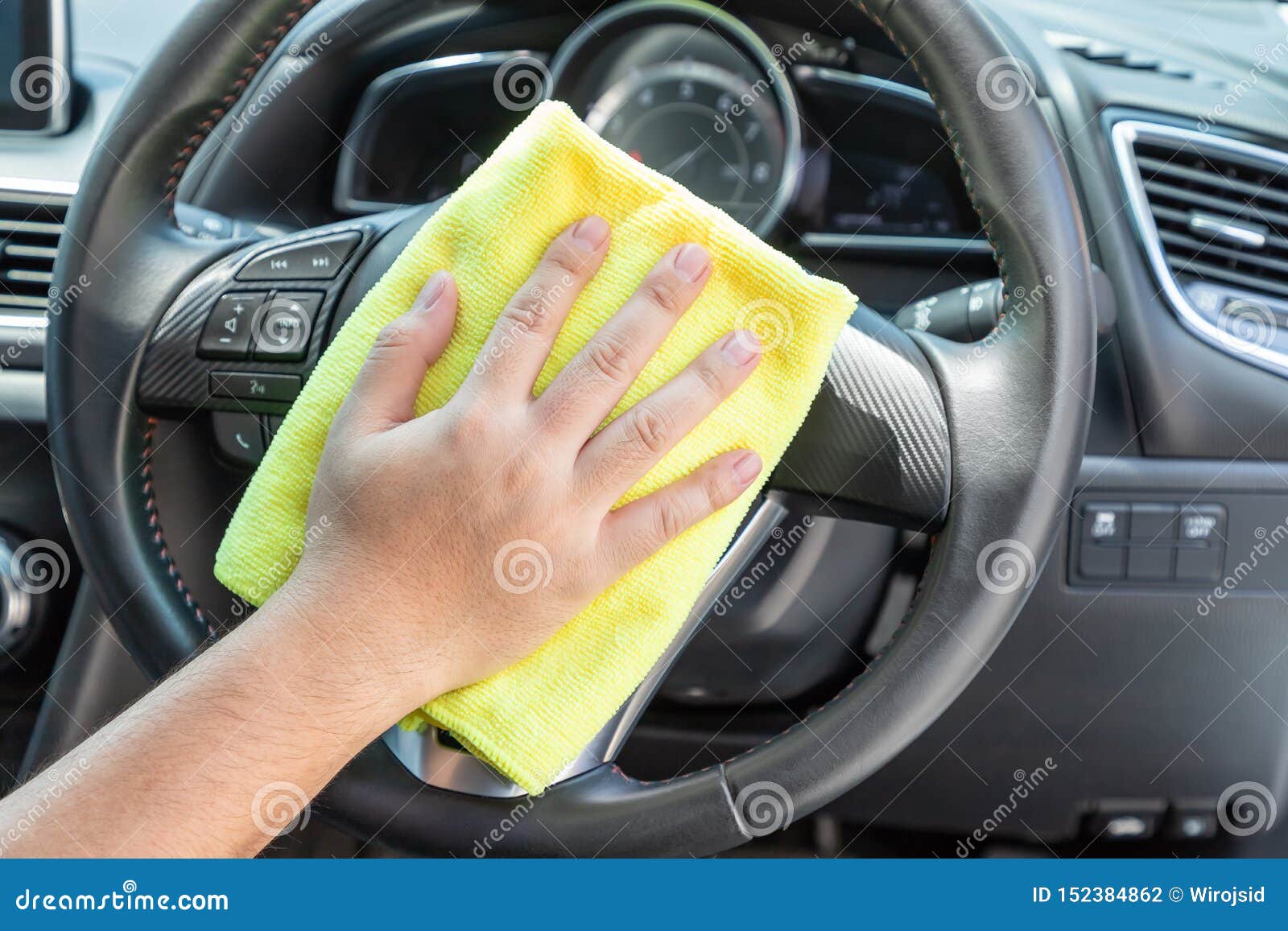 Auto Service Worker Cleaning Inside Car with Micro Fiber Cloth Stock
