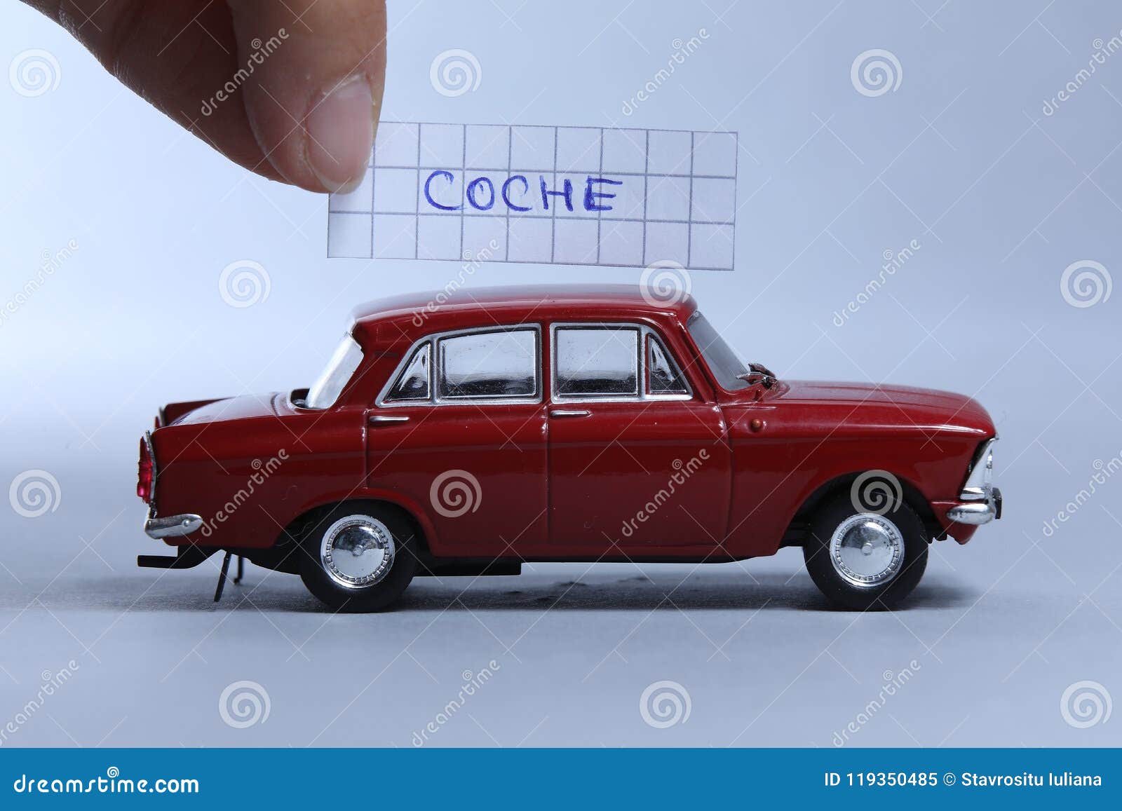 auto word written on a piece of paper, coche in spanish