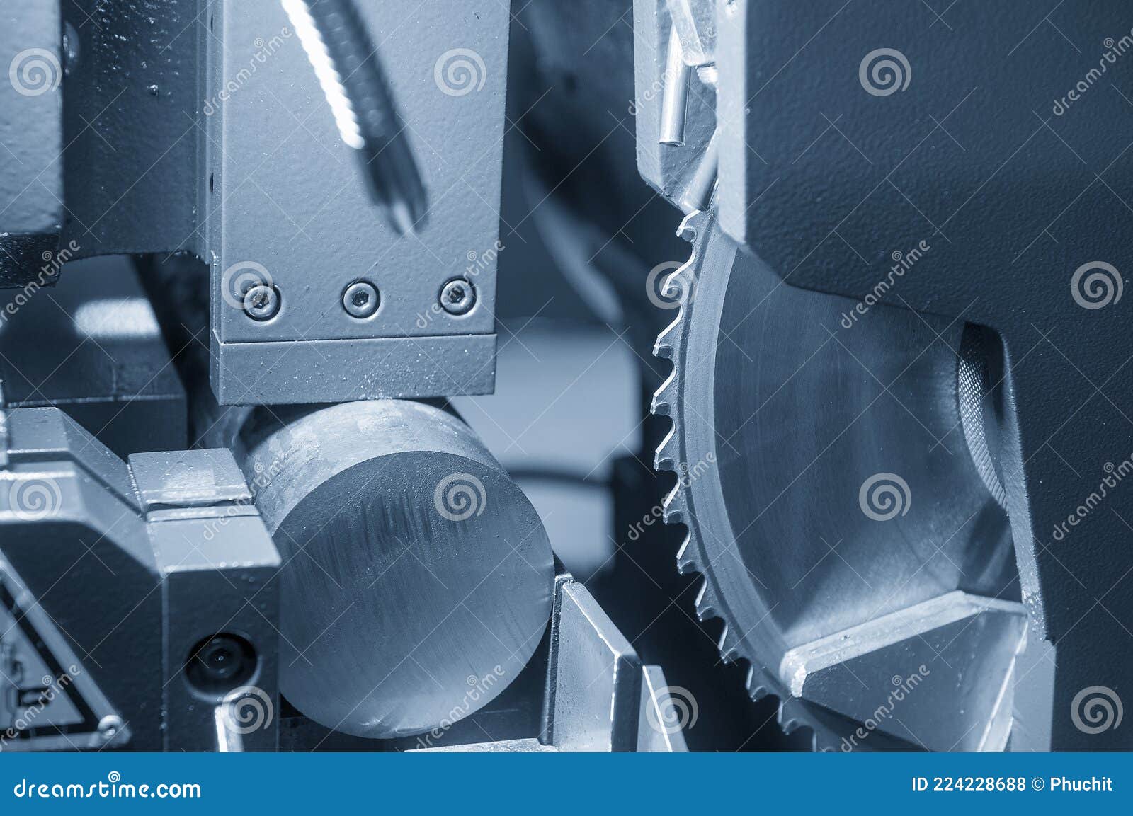 The Automatic Band Saw Machine Cutting the Metal Bar . Stock Photo