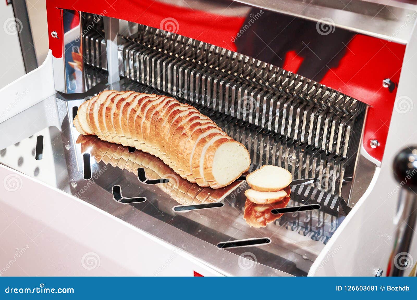 Sliced Bread in Cutting Machine / Industrial Bread Slicer in Supermarket  with Bread Crumbs. Ready to Use Stock Photo - Alamy