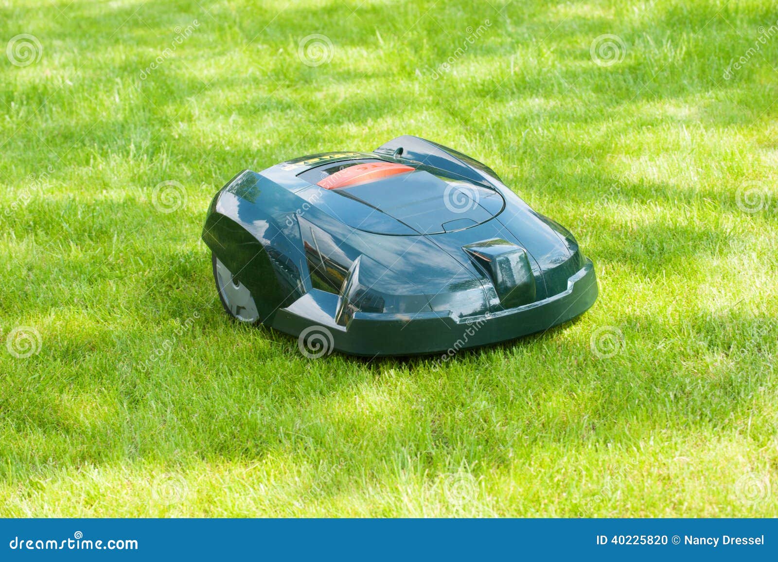 Automatic mower at work stock photo. Image of charging - 40225820