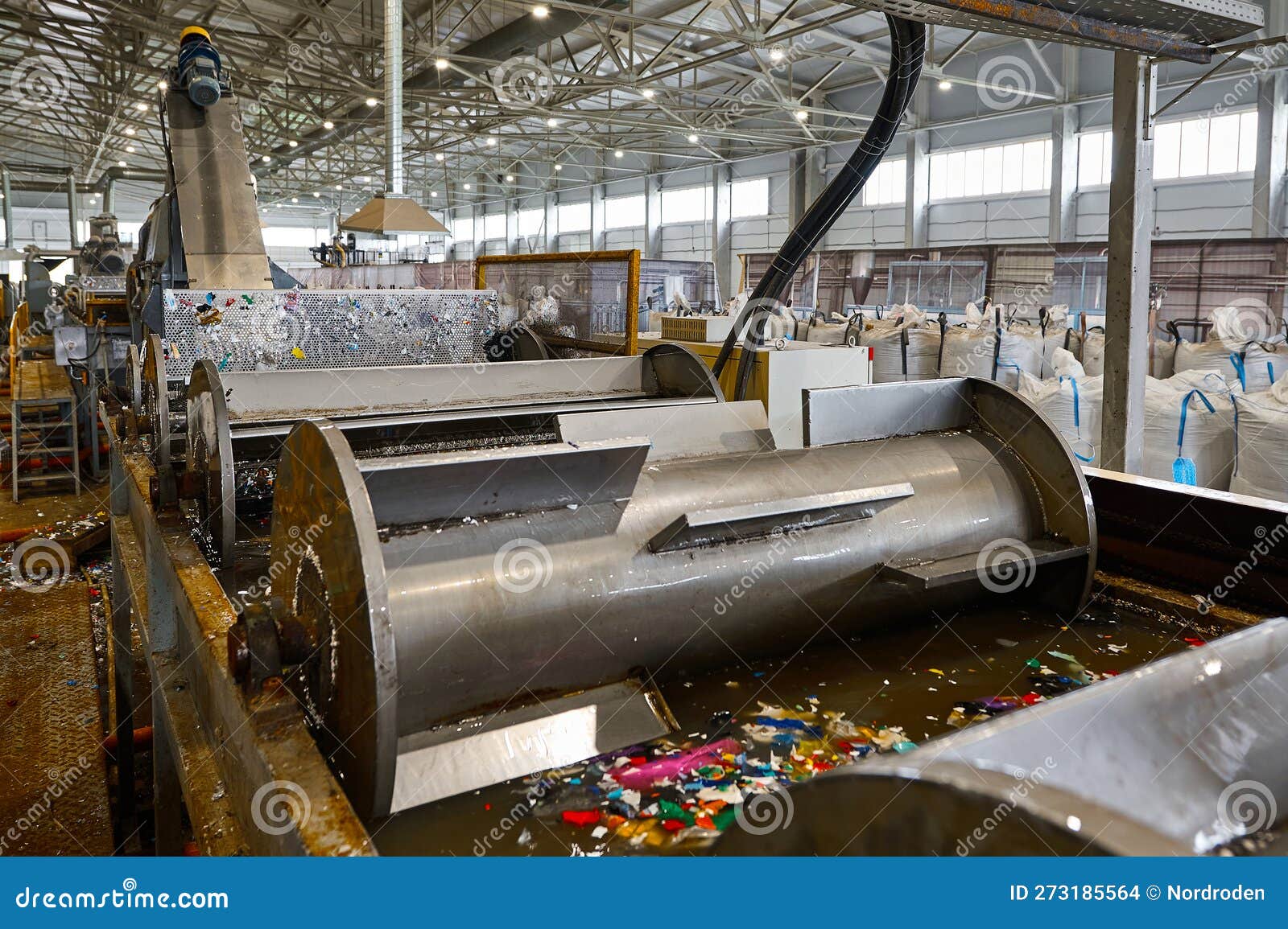Automatic Shredded Plastic Washing Machine. Washing in a Bath of Water
