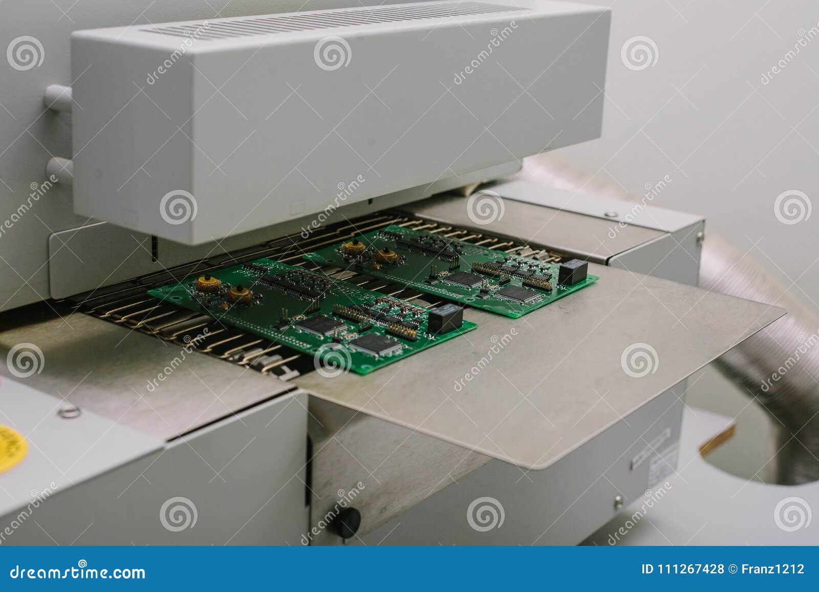 Automation of machine assembly of computer circuit board in the factory for  the production of computer components. The process of soldering the board.